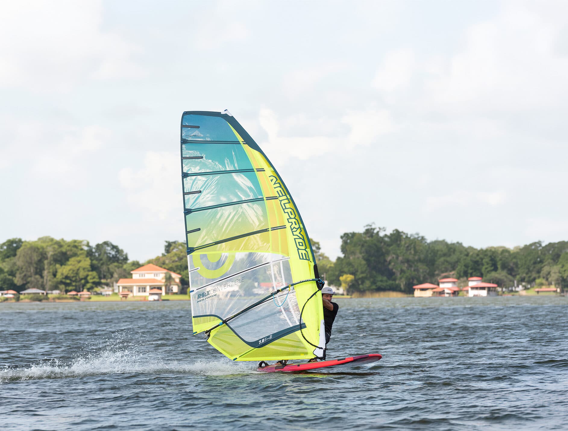 Windsurfer in action with colorful sail on Lake Fairview