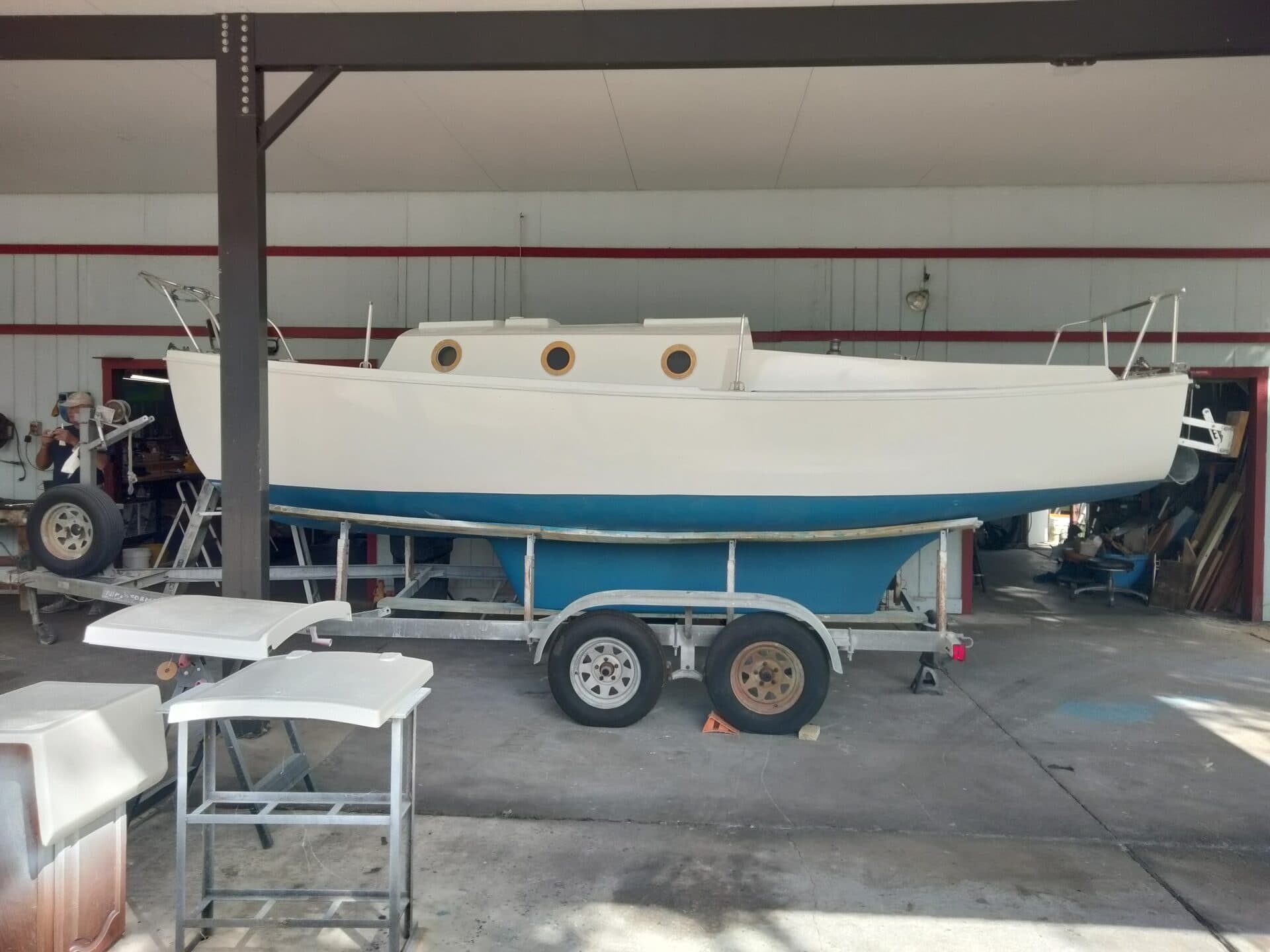 Technician working on boat engine in professional workspace